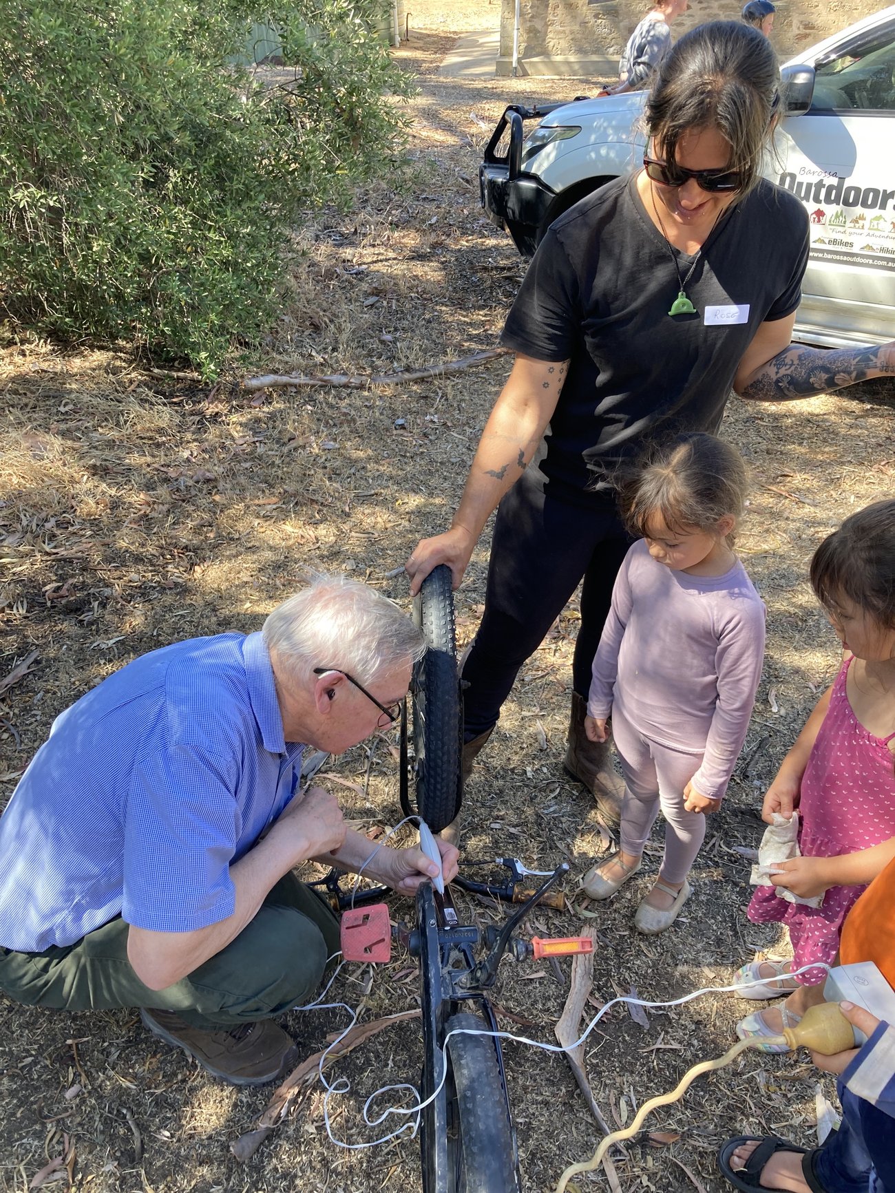 Bill engraving a child’s bike