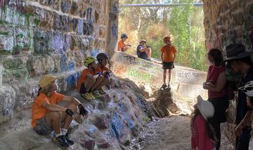 Dr Williams giving a talk under the bridge