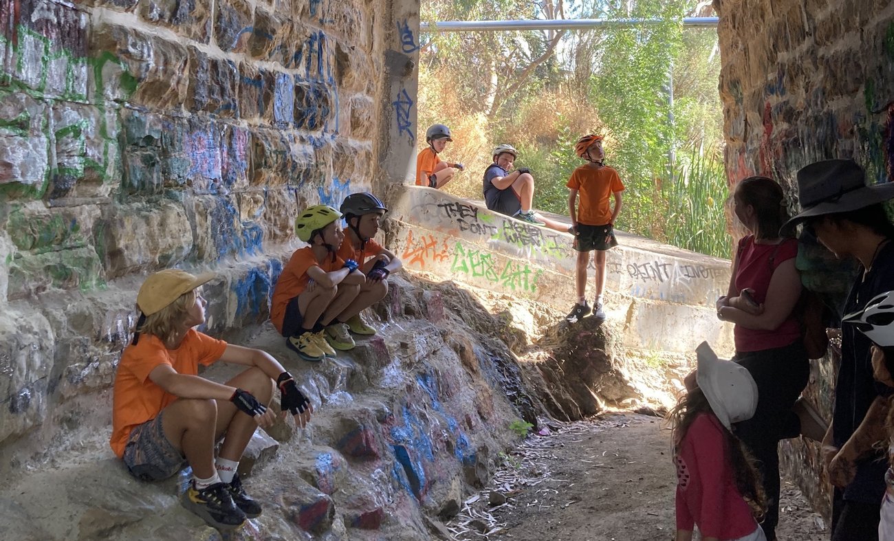 Dr Williams giving a talk under the bridge