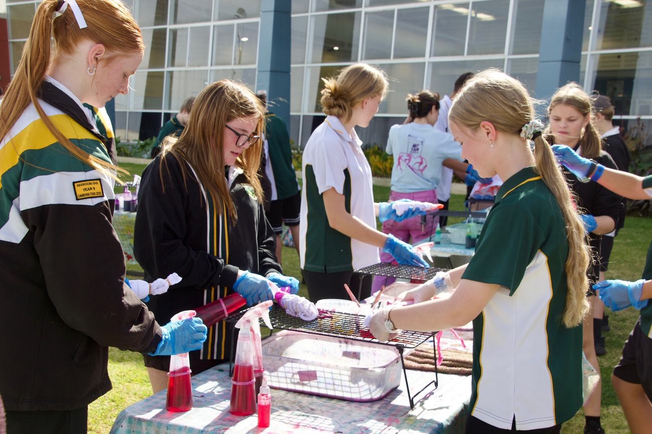 Young people tie-dyeing t-shirts at a Within Your Wallet activity in Pingelly